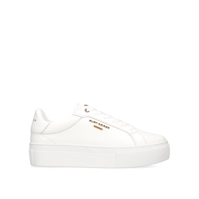 This Kurt Geiger Greenwich Cupsole sneaker features a white leather upper with lace up fastening. There is antiqued brass branding on the eye stay and micro head eagle on the tongue. Sole height: 4cm.