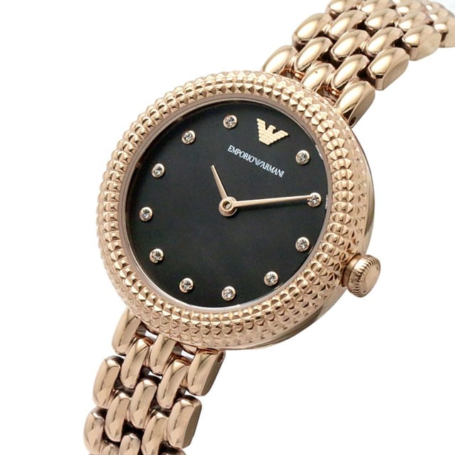 This Emporio Armani Rosa Analogue Watch for Women is the perfect timepiece to wear or to gift. It's Rose Gold 30 mm Round case combined with the comfortable Rose Gold Stainless steel watch band will ensure you enjoy this stunning timepiece without any compromise. Operated by a high quality Quartz movement and water resistant to 3 bars, your watch will keep ticking. This original fashionable watch is set with beautiful stones, perfect for every women. High quality 19 cm length and 12 mm width Rose Gold Stainless steel strap with a Deployment clasp Case diameter: 30 mm,case thickness: 7 mm, case colour: Rose Gold and dial colour: Black