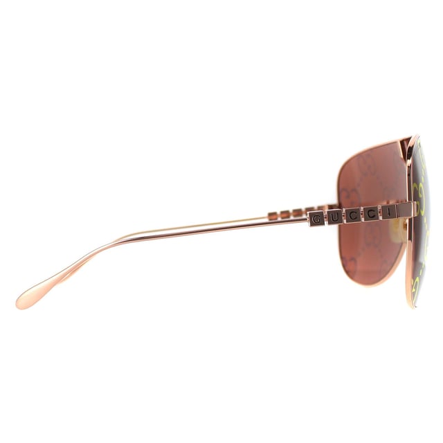 Gucci Shield Womens Gold Red GG1436S  Sunglasses are a perfect fusion of modern elegance and cutting-edge sun protection. Crafted with precision, the lightweight yet durable frame ensures long-lasting comfort, making these shield sunglasses a versatile accessory for any occasion. Offering exceptional UV protection, the GG1436S shields your eyes from harmful rays while providing a range of lens options to suit your personal style. With a snug fit designed for all-day wear and a travel-friendly, compact design, these sunglasses effortlessly combine fashion and function.