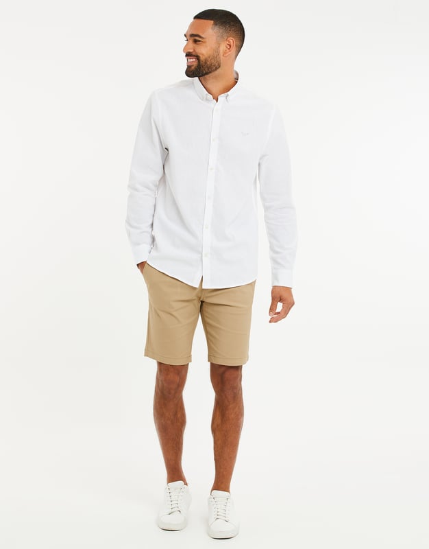 Add style to your outfit with this lightweight cotton-linen blend shirt from Threadbare. It is designed in a regular fit and features a button-down collar, long sleeves, and a brand logo on the chest. Available in other colours.