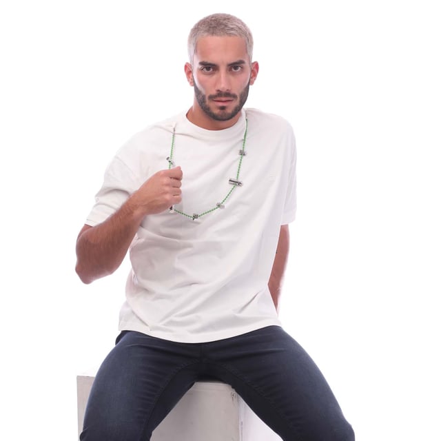 Ambush Stoppers T- Shirt in green.- Ribbed crewneck.- Short sleeves.- Ribbed trims.- Contemporary edge and rebellious leanings.- Cord necklace embellishment.- 100% Cotton.- Ref: BMAA0550010255
