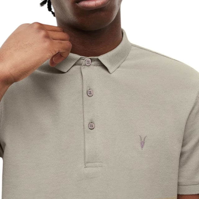 All Saints Men’s Pique SS Polo Shirts
Style Name: Reform
Style Code: M075PB
100% Cotton
Made In India
Slim Fit
3 Button Placket
Ramskull Logo to the Chest
Knitted Rib Collar And Cuffs
Short Sleeve
Casual Wear, Comfort Fabrics
Soft And Breathable
Machine Washable