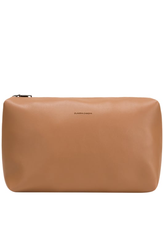 This tote bag is the perfect balance of style and convenience. Its versatile design, featuring both shoulder straps and a crossbody option, ensures it adapts to your lifestyle while maintaining a sleek and polished look. 
Features: 
Detachable adjustable crossbody strap.
Twin shoulder straps.
Debossed logo.
Mag-dot fastening.
Removable pouch with zip fastening.