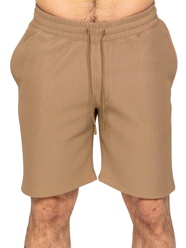 Elevate your summer style with our Enzo Milano Men's Outfit Set, including a textured ribbed revere shirt and relaxed fit shorts. Experience ultimate comfort with a button fastening and adjustable drawstring waistband, while looking effortlessly stylish with a revere collar and single back welt pocket. Made with premium fabric, this set is perfect for any occasion.
