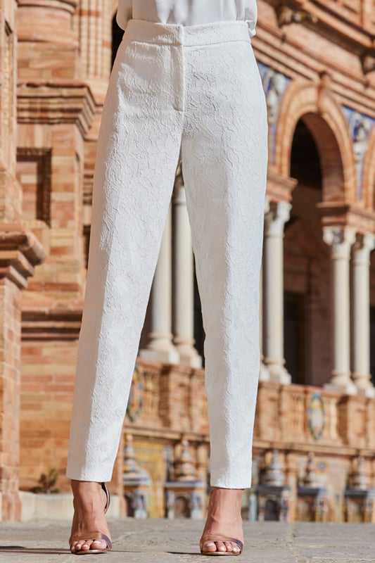 REASONS TO BUY:

Crafted from gorgeous white lace
Fully-lined for comfort and coverage
Chic tapered legs
There's a matching blazer too
The perfect alternative wedding look

Inside leg to fit: Short 29" | Regular 31" | Long 33"