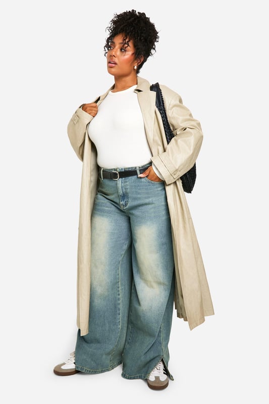 Wide-leg silhouette for a relaxed, on-trend look
        Vintage wash effect adds character and depth
        High-rise waist for a flattering fit
        Roomy pockets for practicality
        Versatile denim fabric suitable for various occasions
    
    Make a bold statement with these plus-size wide-leg jeans from Boohoo. The vintage wash lends a lived-in charm, perfect for achieving that coveted effortless style. The high-rise waist cinches you in at your smallest point, creating a flattering silhouette that pairs beautifully with both cropped tops and tucked-in blouses. For a casual daytime look, team with a simple white tee and trainers. When the evening calls, dress them up with a silky camisole and heeled mules. The roomy leg allows for maximum comfort and movement, ideal for family gatherings or casual Friday at the office. These jeans are a versatile wardrobe staple that can be styled countless ways, making them a must-have for the fashion-forward woman who values both style and comfort.
