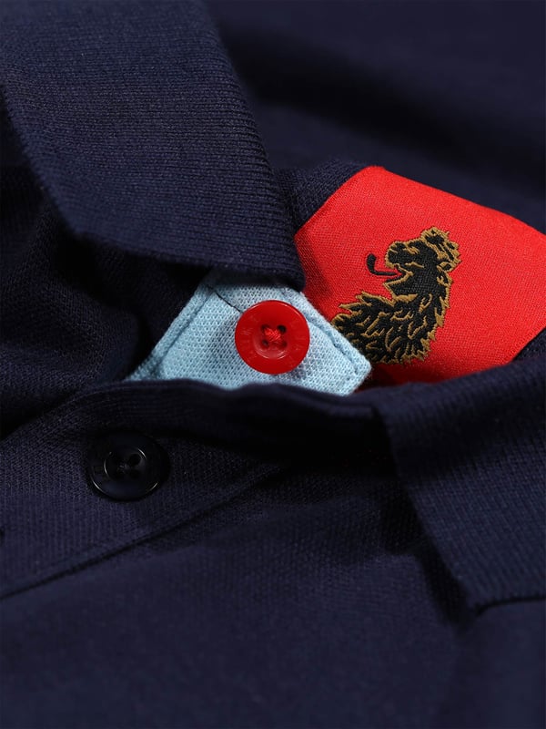 This polo shirt from LUKE is perfect for your everyday line-up. It's crafted from a soft cotton pique and detailed with yarn dyed contrast stripes across the chest. It features a classic button placket which has a contrast colour underside and is complete with the brand's iconic lion head embroidery on the left chest. Iconic LUKE BLACK, GOLD, RED lion head embroidery. Iconic LUKE tri-colour trim tape. LUKE buttons. Contrast yarn dyed chest stripes. Rib collar and cuff. Contrast colour underside of collar.