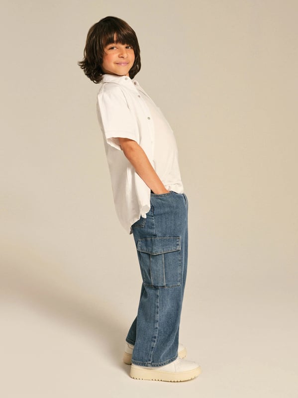 Introducing the Kids Zeke Wide Leg Jeans in Blue, expertly crafted by DL1961 for a fashionable unisex style. Elevate your child's clothing collection with these distinctive features: Sophisticated Design: This piece boasts wide-leg styling, embracing the ongoing trend for a statement look. Superior Comfort: Crafted from soft, high-quality denim, these jeans offer tailor-made comfort for your child's daily escapades. Exquisite Colour: The bold blue hue guarantees a chic and stylish wardrobe upgrade. Unisex Versatility: These jeans are designed for both boys and girls, ensuring an effortlessly cool look. Revamp your kids' wardrobe with the Kids Zeke Wide Leg Jeans in Blue from DL1961. Let your little ones lead in style!