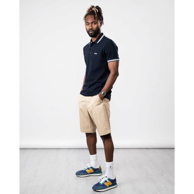 A signature polo shirt by BOSS Menswear, cut to a regular fit. Featuring contrast tipping and a logo at the left chest, this short-sleeved polo shirt is designed in cotton piqué and detailed with further BOSS branding at the undercollar.
Regular fit. Flat-knit collar. Number of buttons: 3. Short sleeves. Flat-knit cuffs. Standard length.
100% Cotton
50469055
Model is 5"8 and wears size M