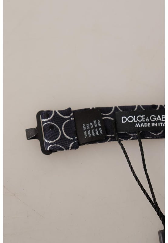 Stunning Dolce & Gabbana bow tie
  Color: Black and White Round
  Model: Tied
  Material: 100% Silk
  Adjustable length neck strap
  Made In Italy
  Width: 7cm