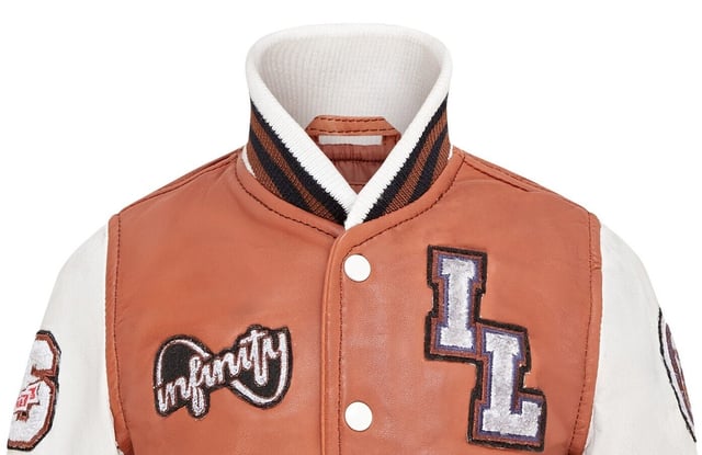 Introducing the Unisex Kids Baseball Leather Jacket, a perfect blend of classic varsity style and modern craftsmanship. This letterman bomber jacket features contrasting sleeves and a striped knit ribbed collar, waistband, and cuffs for a timeless athletic look. The press studs front closure and embroidered brand logo patches on the chest and sleeves add a touch of authenticity and flair. Designed with practicality in mind, it includes two jet pockets at the waist and two inside welt pockets for your essentials. The panelling to the back of the jacket ensures a tailored fit and superior comfort. Contrasting sleeves for a stylish look, Striped knit ribbed collar, waistband, and cuffs for a classic finish, Press studs front closure for easy wear, Embroidered brand logo patches on the chest and sleeves for added detail, Two jet pockets at the waist.