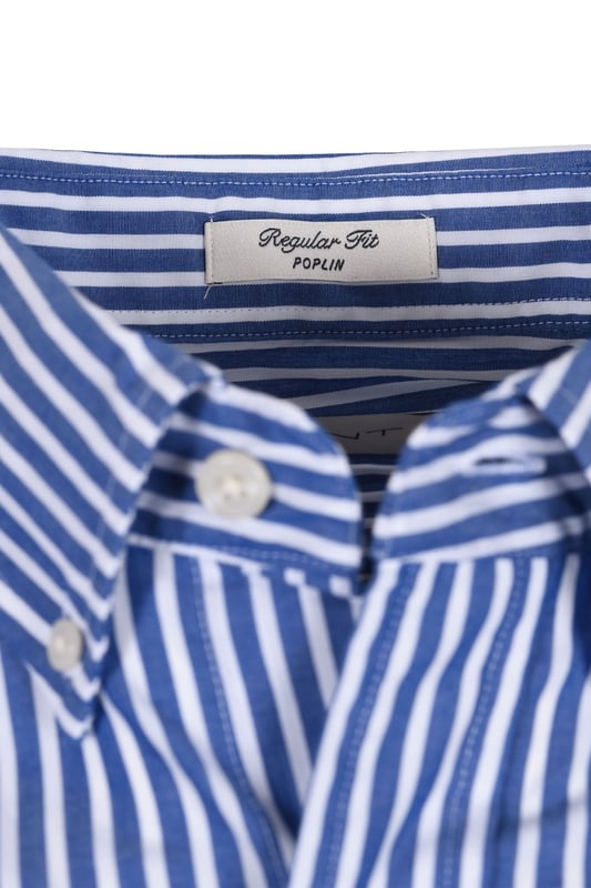 Gant Reg Poplin Stripe Shirt College Blue
100% cotton, regular fitting, with a box pleat to the back for added room and comfort. The durable and crisp poplin fabric looks and feels fantastic when worn, anf the very easy to style stripe is a must for your shirt rotation

100% Cotton
Poplin Fabric
Embroidered Badge
Style - 3000130