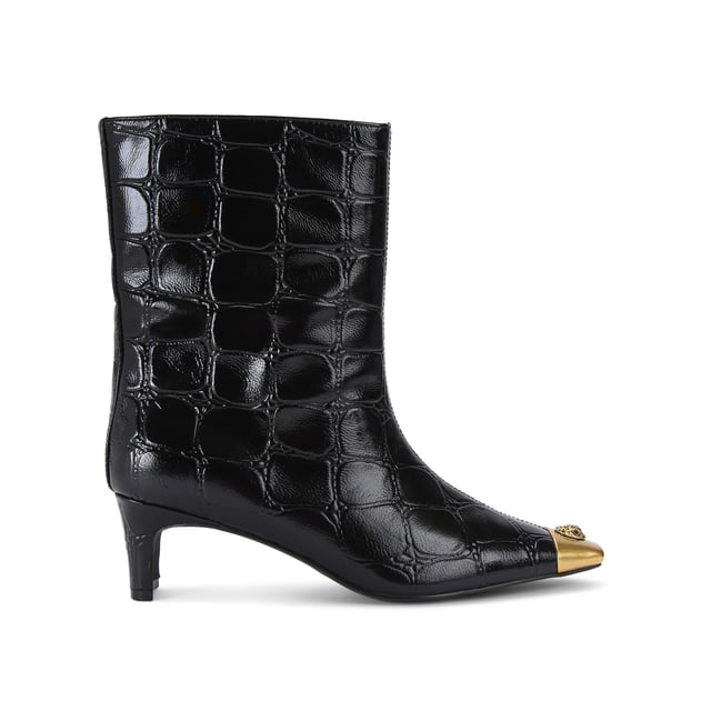 This Kurt Geiger Regent Ankle Boot features a black croc embossed upper with antiqued brass toe cap. There is an antiqued brass eagle head sat on top of the toe all sat on a fashionable kitten block heel. Heel height: 5.5cm.