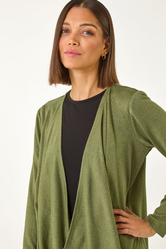 Waterfall Stretch Cardigan from Roman. Add a touch of cosiness to your Autumn/Winter wardrobe with this stylish waterfall cardigan. Designed with a wooly touch, this cardigan features long sleeves for extra warmth. Perfect for layering over a simple t-shirt and jeans for a chic and casual look that will keep you snug all season long!