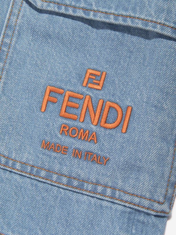 Introducing the Fendi Boys Big Pocket Logo Denim Shorts in captivating Blue! Tailor-made for your little man's chic wardrobe, this piece blends fashion with functionality. Highlighting features include:  Italian Craftsmanship: Exemplifying Fendi's unparalleled quality and precision, expertly produced in Italy for unrivalled finish and longevity. Signature Logo Print: The Fendi logo print provides a trendy, high-fashion edge, transforming these shorts into an eye-catching conversation piece. Ultimate Comfort: Manufactured with premium materials to assure softness and comfort, ideal for your boy's day-to-day exploits.Revamp your youngster's wardrobe with these signature Blue Logo Denim Shorts from Fendi. Order now, and let your young one exhibit exceptional style!