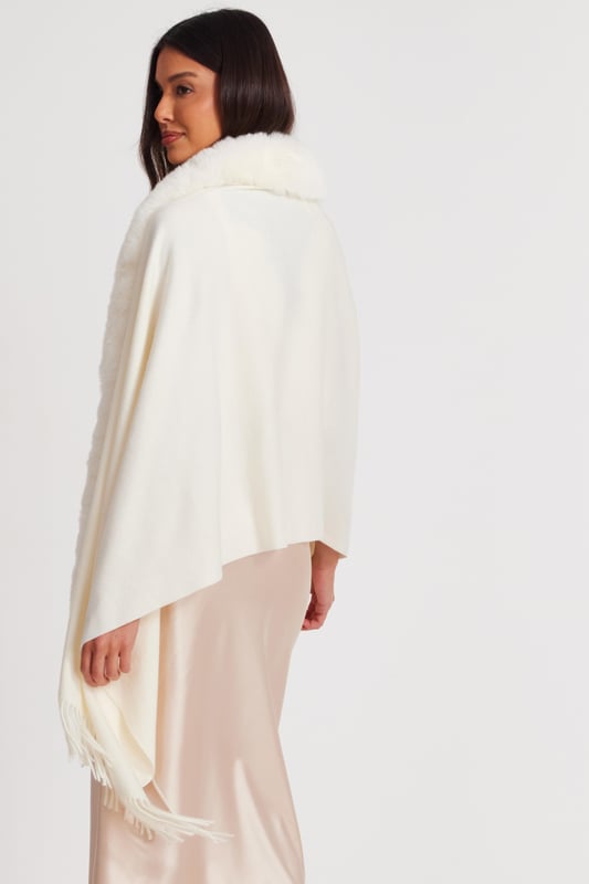 - Knitted - Faux fur collar - Tassel finish - Cape style - Always check the care wash label - Cool hand wash with mild detergent