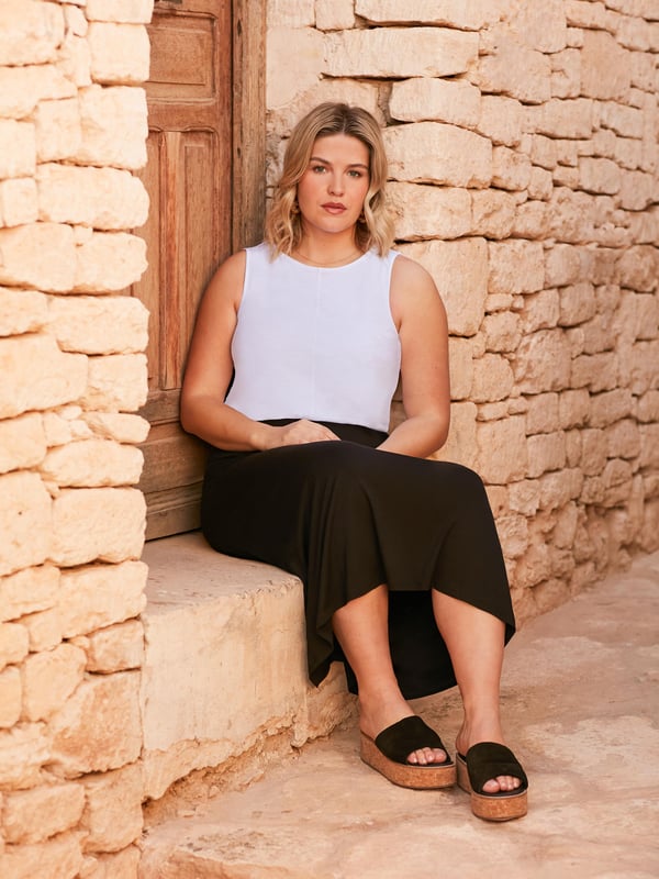 The perfect throw-on piece, this black jersey midi skirt is as flattering as it is comfortable. In a super soft, stretchy jersey, its designed to skim your curves beautifully, and has an elasticated back waistband for the perfect fit. Pair with anything from a T-shirt to a jumper for effortless daytime cool.