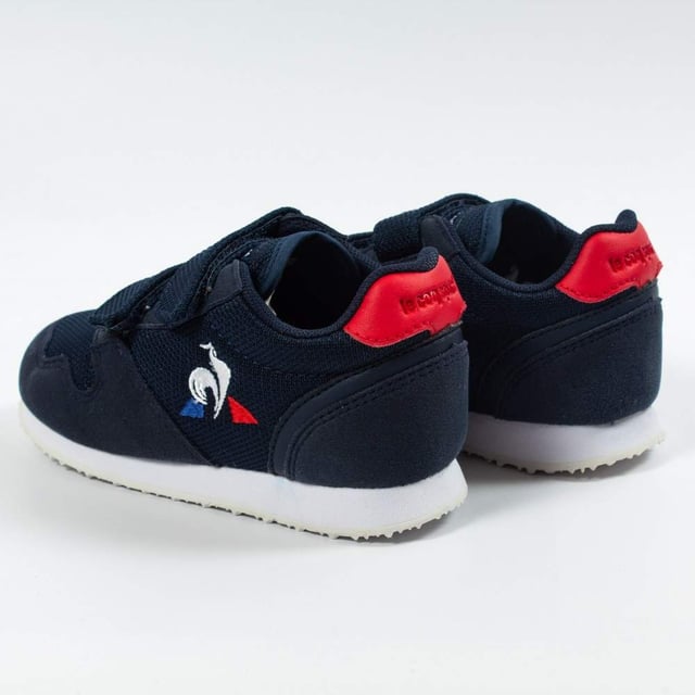 Basket Le Coq Sportif Jazy Inf Jungen Blau Textil. Authentischer Schuh von der Marke Le Coq Sportif - Streetwear/Sportswear Design von Le Coq Sportif - Le Coq Sportif für modebewusste Jungen, perfekt für den Alltag - Der blaue Basket Le Coq Sportif lässt sich ideal mit dem Rest deiner Garderobe kombinieren - Bequemes Textilmaterial - Klassischer Klettverschluss - Jazy Inf - Textil