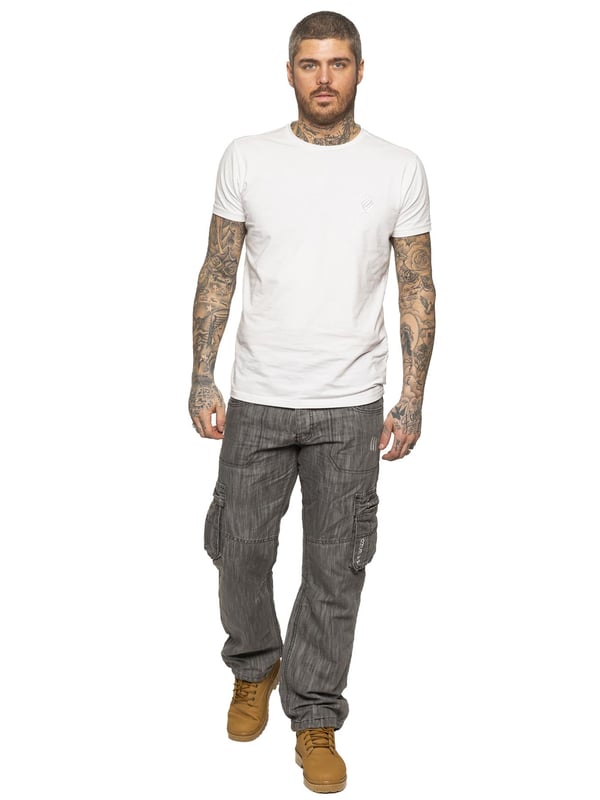 Go back to your roots with these comfortable 7 pocket dark blue combat jeans, featuring cinch buckle to back and draw cords to the bottom of the leg for a more custom fit. Finished off with printed branding to front and back, subtle distressed detail and button fly for a comfort fit.