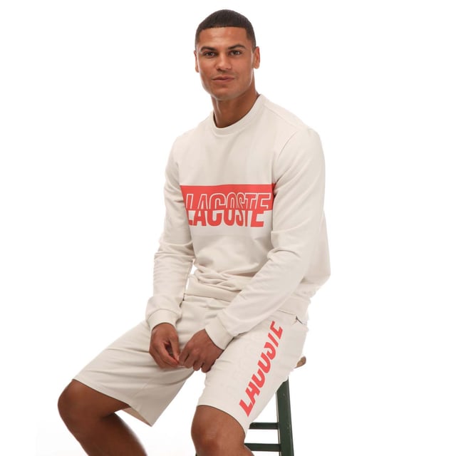 Bold. Colorful. Audacious. A new generation of Active wardrobe. This new style  dedicated to GenZ  have a bold and eye-catching Lacoste print in the middle. Break traditional codes and create a new strong identity with a playful mash up of colors. This sweatshirt is a fashion must-have. Loungewear sweatshirt Regular fit: natural ease on body Lightweight French terry Crew neck Ribbed cuffs and body bottom Bicolor cut and shifted Lacoste branding on chest 