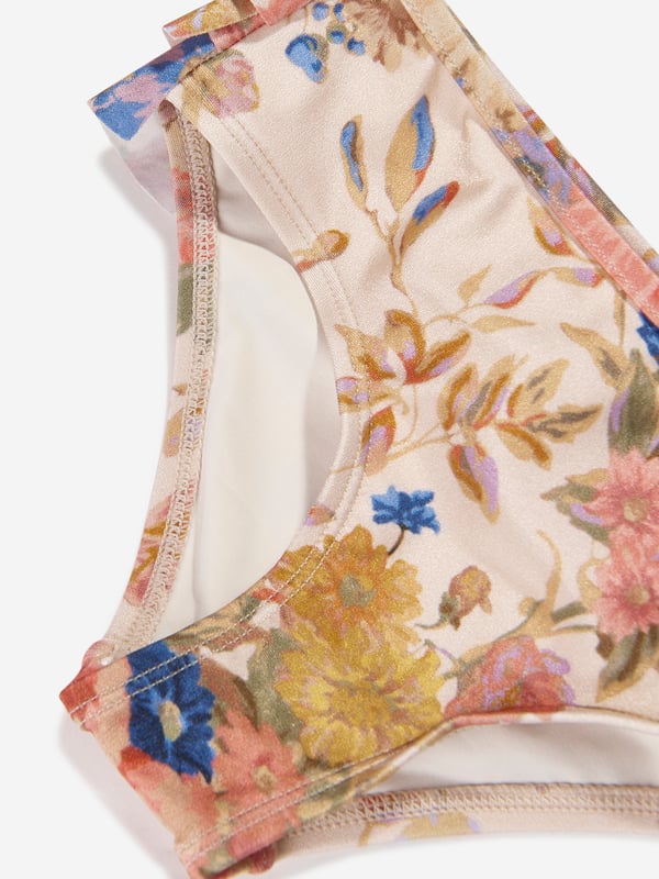 Presenting the stunning Girls August Frill Bikini Bottoms in Multicolour by Zimmermann, a lavish addition to your girl's holiday wardrobe! Key features include: Vibrant Multicolour Design: The eclectic and trendy print adds a vibrant aura, transforming it into a statement piece for those sunny beach days. Supreme Comfort: Crafted from top-tier materials, this swimsuit promotes utmost comfort, ensuring your little one enjoys her day in the sun! Stylish Wardrobe Update: Revive your kid's wardrobe with Zimmermann's Frill Bikini Bottoms. Get this holiday staple now and let your girl bask in luxury and style!