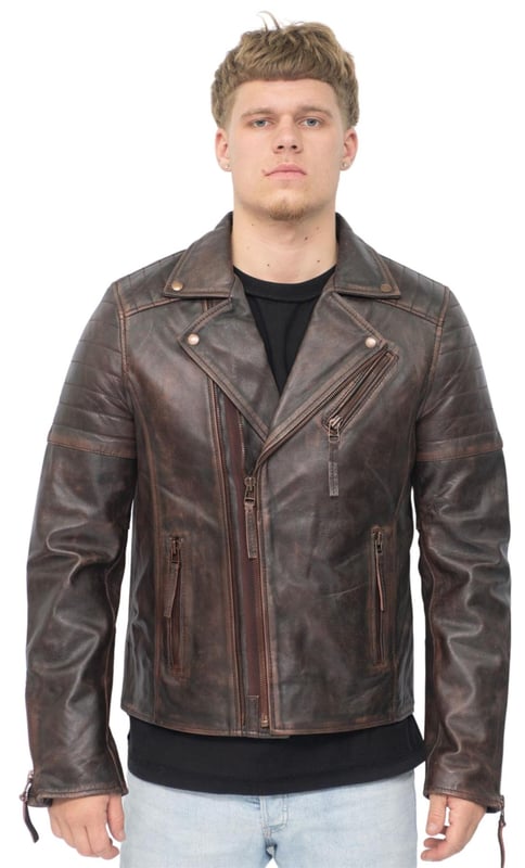 La pieza central de un look atemporal, esta chaqueta está confeccionada con piel de napa de grano completo para lograr una silueta de motociclista elegante y de corte ajustado. Los llamativos detalles de esta prenda incluyen detalles acanalados en los hombros y un cuello ancho tradicional. La parte delantera de la chaqueta está acentuada con una cremallera doble y presenta un bolsillo con cremallera inclinado en el pecho, así como otros dos bolsillos con cremallera. Esta chaqueta viene en una gama de colores para adaptarse a una variedad de gustos, lo que permite que todos encuentren su estilo ideal en esta clásica pieza de estilo Brando. • 100% piel de napa ultra suave de primera calidad. • Bolsillo en el pecho con cremallera inclinada • Doble cremallera delantera, etiquetada para facilitar su uso • Solapas anchas con botones a presión • Bolsillos integrados en el forro de la chaqueta • Puños con cremallera elegantes • Detalles acanalados en los hombros