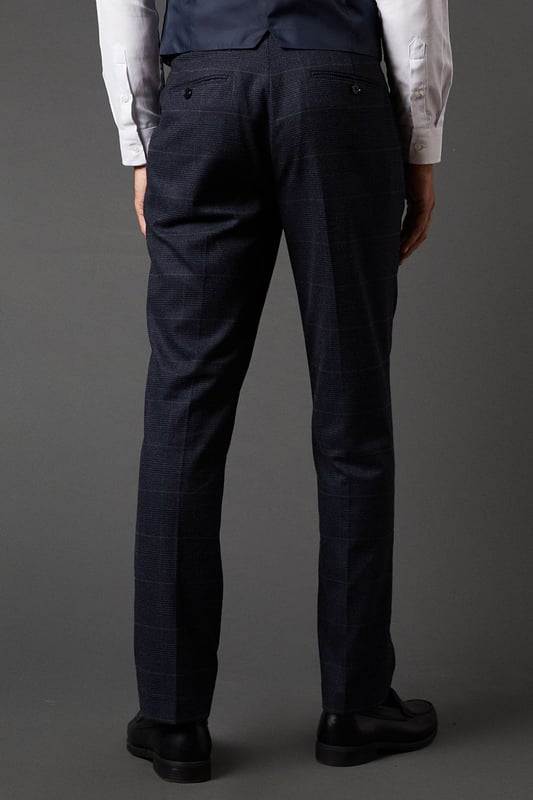 Tailored fit trousers for a refined silhouette
        Distinctive pow check pattern adds visual interest
        Side pockets for practicality
        Belt loops for versatile styling options
        Tapered leg design for a modern look
    
    These Burton pow check trousers offer a sophisticated twist on classic tailoring. The tailored fit sculpts your silhouette while providing comfort and ease of movement. Perfect for the discerning gentleman who appreciates timeless style with a contemporary edge. Pair with the matching jacket and waistcoat for a complete suit that commands attention at formal events or important business meetings. For a smart-casual ensemble, team with a crisp white shirt and leather brogues. The versatile design allows for effortless transition from day to night, making these trousers an essential addition to any well-curated wardrobe. Whether you're heading to the office, attending a wedding, or enjoying a night out at your local pub, these trousers will ensure you look polished and put-together.