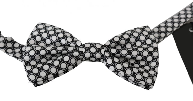 100% Authentic Dolce & Gabbana Bow Tie
  Exclusive design from Dolce & Gabbana collection
  Color: Black White Circles
  Model: Tied
  Material: 100% Silk
  Adjustable length neck strap
  Made In Italy
Material: 100% Silk