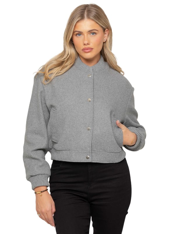 The Women's Wool Bomber Jacket features a stylish ribbed collar and cuffs, complemented by a classic button-up design. Crafted from premium soft fabric, it offers a comfortable and relaxed fit. With two functional side pockets and a cropped silhouette, this jacket blends both style and comfort effortlessly. Made from a high-quality blend of 96% polyester and 4% elastane, it's machine washable for easy care