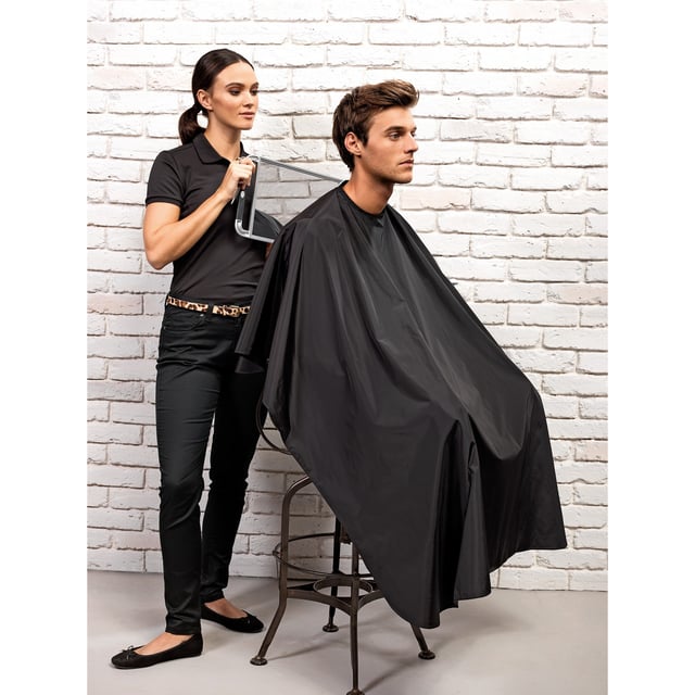 Our waterproof salon gown offers full body coverage against spillages, lotions, potions and hair cuttings. The gown fits comfortably around the neck and is secured in place with a touch fastening at the back. It also has a handy fabric hook for hanging up. 100% Polyurethane coated polyester. 110gsm.