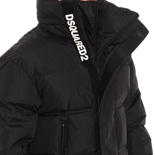 Padded jacket Dsquared2.
 Filling 90% Duck down, 10% Duck feather.
 High collar with zipper.
 Two-way zipper closure.
 Elastic cuffs.
 Two pockets with zipper closure on the sides.
 One pocket with snap button closure on the inside.
 Brand print on the upper side.
 Seams seen in tone.
 Composition: Exterior: 100% Polyamide, Interior: 100% Polyamide, Filling: 90% Duck down, 10% Duck feather.
 Care:
Do not wash.
 Do not iron.
 Do not use bleach.
 Do not use dryer.
 Do not dry clean.