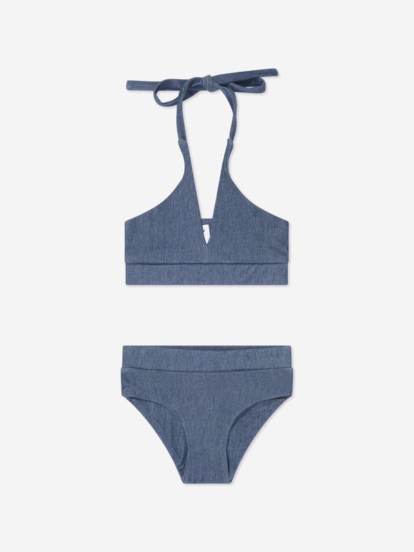 Take poolside cool to another level with this girls blue halterneck bikini set from AY by Ayla. The denim-style set leaves am impression when making a splash. An elasticated band across the hem and waistband ensures a comfortable fit for free and easy movement. 2 Piece Set Halterneck Tie Fastening Elasticated Trims