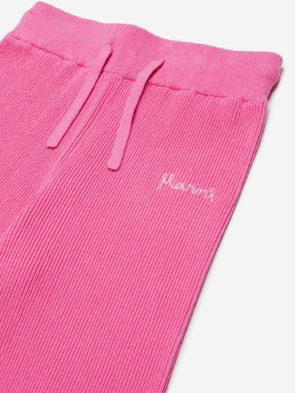 Introducing the **Girls Knitted Trousers in Pink** by Marni, a luxurious addition to your little girl's AW2024 wardrobe. Crafted with precision and care, these trousers promise both elegance and Cosiness. Perfect for stylish comfort during the colder months. Key features include: **Exquisite Craftsmanship:** Skillfully knitted using premium materials for warmth and durability. **Chic Comfort:** Offers a snug fit with a soft, flexible waistband ensuring comfort all day long. **Versatile Elegance:** Beautiful rich pink hue complements various tops and shoes, making it easy to style.Step into style with Marni's latest creation for young fashionistas. Elevate her winter fashion today!