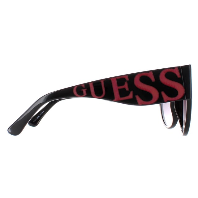 Guess Cat Eye Womens Shiny Black Smoke Gradient GF6118  Sunglasses are a cat-eye style crafted from lightweight acetate. The brand's logo is showcased on the temples for authenticity.