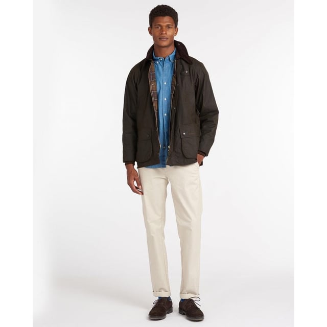 At the very heart of the Classic collection and a firm favourite year after year, the Classic Bedale is made using Barbour's 6oz Sylkoil.
Originally introduced for riding, this relaxed-fit jacket is now a seasonal staple in town and country alike, with a mediumweight waxed cotton outer that's comfortable to wear and offers robust weather protection. The two-way front zip is reinforced by hardy stud fastenings to seal out wind and rain, while moleskin-lined handwarmer pockets and generous bellow pockets are winter must-haves. A sit-down collar in signature corduroy creates a smart appearance, but can also be raised for additional protection in bad weather, with a luxurious feel against the face and throat.
Retaining unmistakeable Barbour authenticity, the Classic Bedale features a 100% cotton lining in the Original Classic Tartan print, adding an eye-catching heritage detail. This traditional men's waxed jacket is compatible with Barbour's zip-in liners and optional hoods, for all-round versatility.

100% waxed cotton outer
Pure cotton lining
100% cotton sleeve lining
Inner ribbed sleeves
Two way zip
Corduroy collar
Two handwarmer pockets
Two large bellow pockets
Back length: 76 - 81cm's | 30" - 32"
Studded for optional hood
Interactive zip