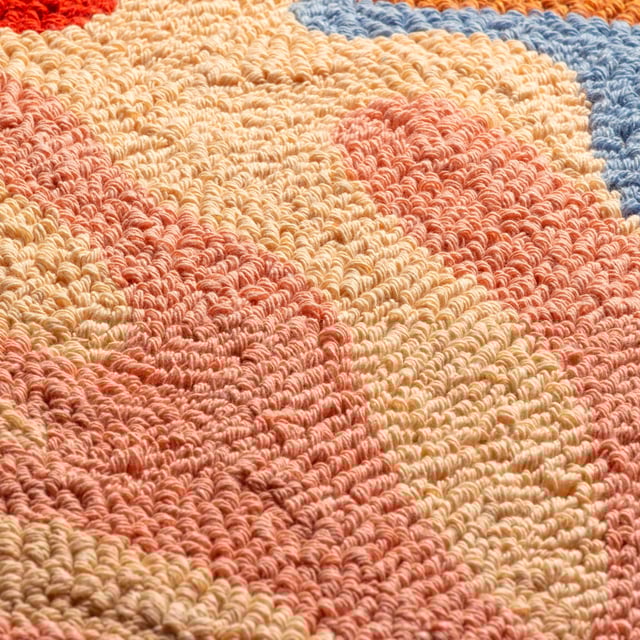 The Corals cushion gives those beach day vibes. It is made up entirely of a unique loop tufted cotton to create a cool abstract design of a sea bed and beach, with large corals growing nearby. Finished with a polycotton canvas reverse, knife edge trim and zip fastening. A fun, friendly and huggable fashion piece to throw on your sofa and help create your own unique living space. Size: 45 x 45cm.
