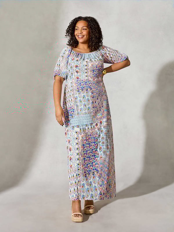 Details

Elastic bardot neckline
Short sleeves with gathered elastic cuffs
Side split in hem
Maxi length
Empire seam

Garment Care

Composition: 98% Viscose 2% Elastane
Machine washable  

Sizing

Model height: 5ft 10inches/178cm
Length from back neck to hem: 111cm

Printed all over with a pretty mosaic print, this maxi dress is cut from a soft woven fabric that moves beautifully. It has an elasticated neckline which can be worn on or off the shoulder, as well as short, elasticated sleeves which create an elegant silhouette when paired with its empire seam and side split at the hemline.