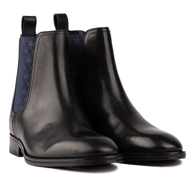 Step Into Pure Luxury With The Lineus Chelsea Boot From Ted Baker. With A Geometric Elastic Panel On The Ankle, These Classic Chelsea Boots Add A Contemporary Twist To A Classic Style. High-quality Top-grain Leather And A Comfortable Fit Make Them Perfect For Any Occasion, Whether You're Dressing Up Or Down, Adding A Sophisticated Flair To Your Looks.