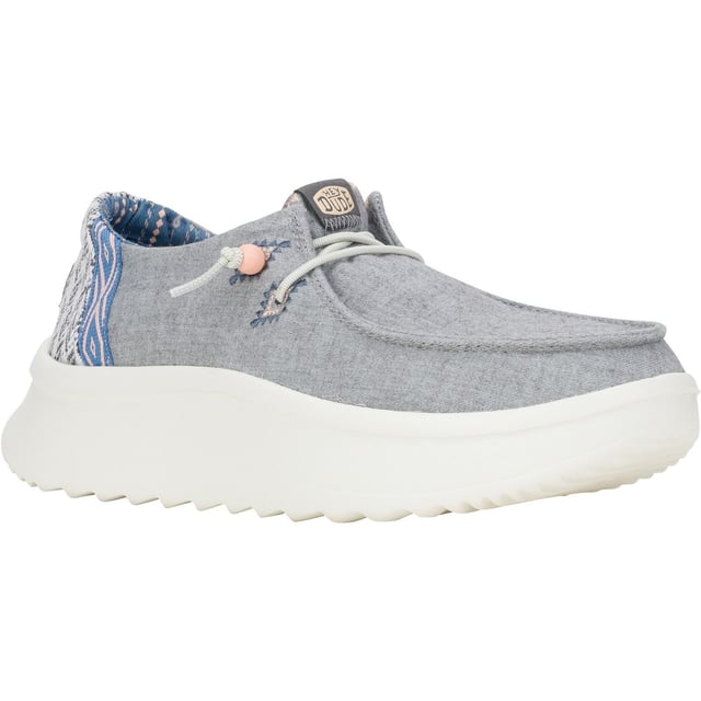 Up your style game with Wendy Peak Chambray Woven. Added, cushy comfort and height meets woven textile heel and webbing details for the perfect mix of comfort and style. So easy to put on you'll never wanna take 'em off.