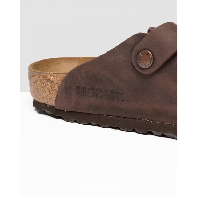 Men's Birkenstock Boston Leather Sandals in Brown Dating back to 1774 and originating from Germany BIRKENSTOCK is globally known for their signature footwear styles influenced by two and a half centuries of brand history. Providing comfort and durability they present these mens Boston Leather Slip On Shoes featuring their signature Birko-Flo skin-friendly material. Details: brown colourway adjustable buckle strap round toe cork footbed leather upper tonal stitching and embossed branding to side to complete.