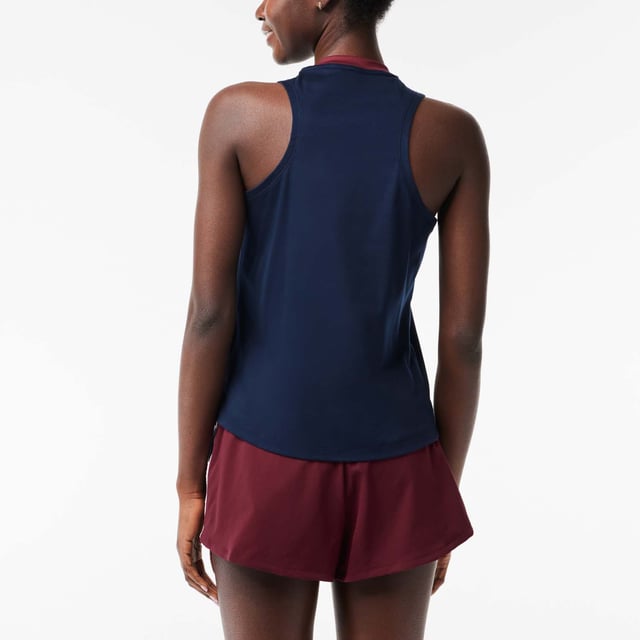 Lacoste Sport Contrast Mouwloos T-shirt voor dames. Ga voor groots contrast en groots comfort in dit rekbare, ademende en vochtafvoerende T-shirt. Ontworpen om je op jouw manier te laten presteren.- Stretch katoen.- Slank, getailleerd model.- Sneldrogend.- Getest door atleten.- Siliconen krokodil op voorkant.- 100% Katoen. Machinewasbaar. Ref: TF1010R1I.