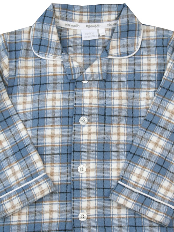 Boys blue check cotton pyjamas blending comfort and style seamlessly. These cosy pyjamas, made from soft, breathable cotton, are prefect for a restful night's sleep or casual lounging. The timeless faded denim blue with caramel and ivory check adds a touch of charm and sophistication to betimes making it a delightful experience for your young lad. Step into a world of comfort and fashion with these classic pyjamas, designed for your boy's relaxation and peaceful nights sleep!