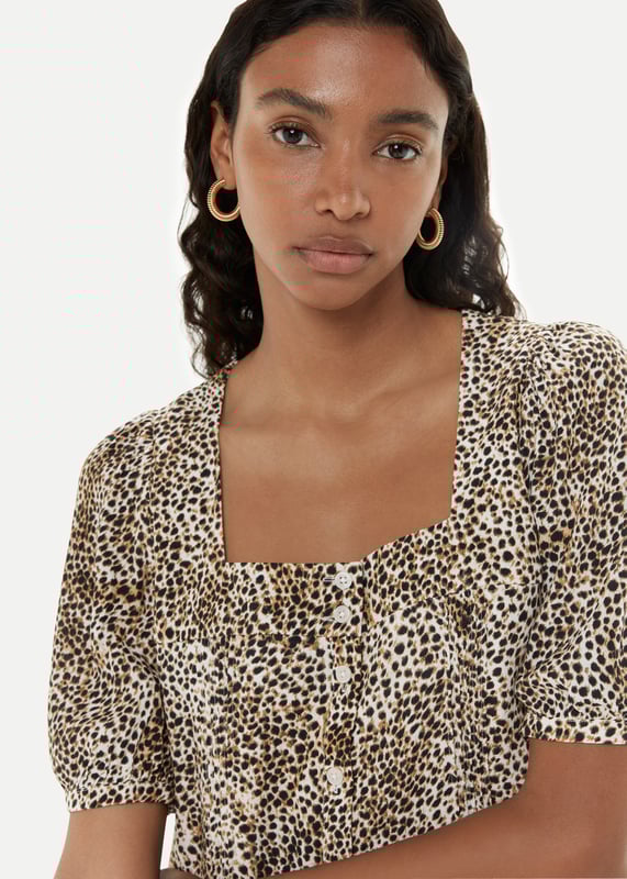 Experience elegance with the Ink Spot Midi Dress - perfect for any special occasion.