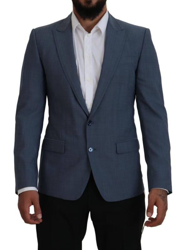 Absolutely stunning 100% Authentic brand new with tags Dolce & Gabbana blazer
  Single breasted style with a blue color and blue inner lining
  Two-button closure
  Logo details
  Made in Italy
  Material: 92% Wool 7% Elastane 1% Polyester
  Lining: 36% Cupro 33% Rayon 31% Acetate
Material: 92% Wool 7% Elastane 1% Polyester