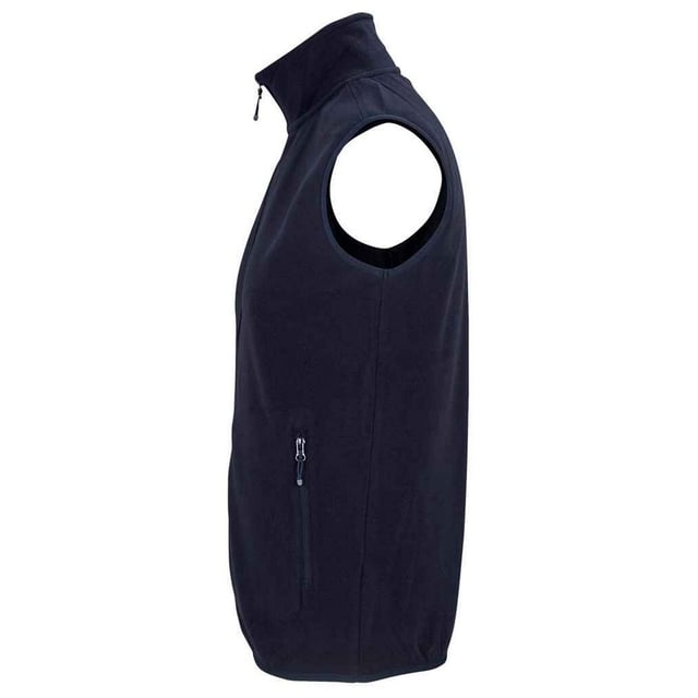 100% Recycled Polyester. Fabric: Microfleece. Design: Plain. 280gsm. Fabric Technology: Anti-Pilling. Bound Armholes, Tearaway Label, Unlined. Cuff: Elasticated. Neckline: High-Neck, Reinforced, Taped. Sleeve-Type: Sleeveless. Pockets: 2 Side Pockets, Zip. Fastening: Full Zip. Hem: Bound, Elasticated. Sustainability: ACCORD, Amfori, BSCI, Fair Wear Approved, GRS Certified, Made from Recycled Materials, Oeko-Tex Standard 100 Certified, PETA-Approved Vegan, REACH, SAC Approved. XS: 36 in. S: 38 in. M: 40 in. L: 42 in. XL: 44 in. XXL: 47 in. 3XL: 49 in. 4XL: 52 in. 5XL: 55 in.