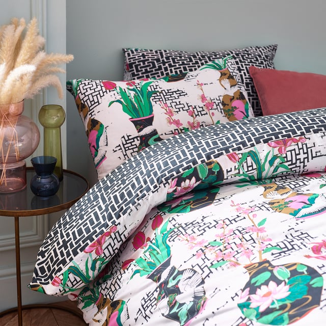 Inspired by Japanese geometric patterns, the injections of colour from the flowers and vases alongside the contrasting geometric monochrome design create a striking and fantastic centrepiece for your bedroom.