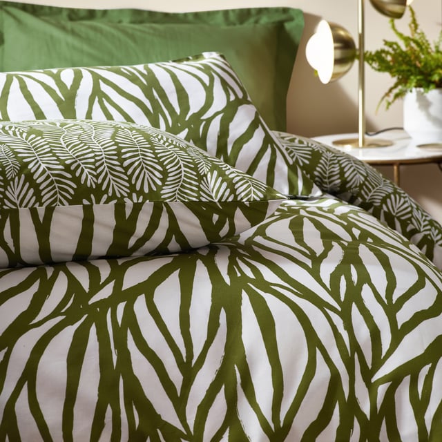 Enjoy some natural sleep in the modern, abstract art-inspired Frond duvet cover set. Featuring a linear leaf design, using fluid painted lines to create movement and texture to your interior. The reverse displays intricately printed fronds on a natural green background, to give you a choice of two nature-inspired designs in one. Either way, the Frond duvet cover set adds a touch of nature to a modern, neutral interior. This product is certified by OEKO-TEX® showing it has been sustainably made.