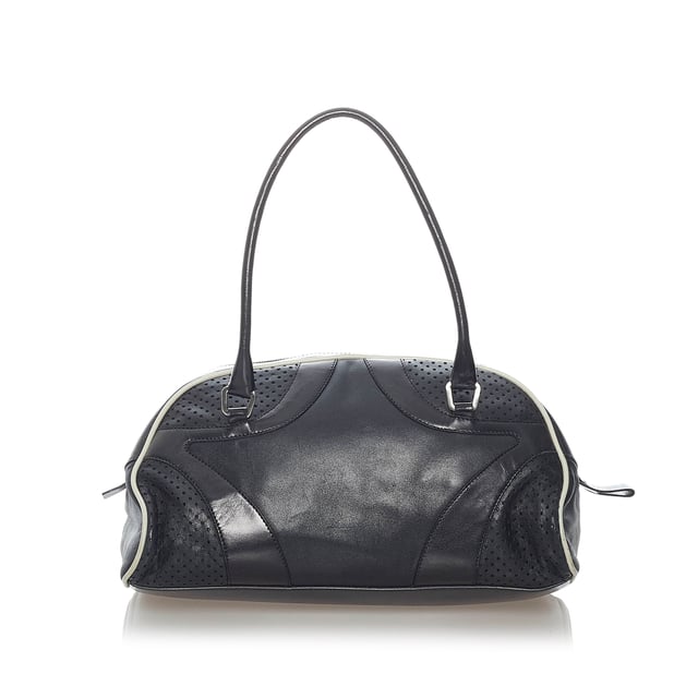 VINTAGE. RRP AS NEW. The Vitello Drive handbag features a perforated leather body, rolled leather handles, a top zip closure, and an interior zip pocket.Exterior back is out of shape and scratched. Exterior bottom is scratched. Exterior corners is scratched. Exterior front is out of shape and scratched. Exterior handle is out of shape and scratched. Exterior side is scratched. Zipper is scratched.

Dimensions:
Length 16cm
Width 28cm
Depth 10cm
Hand Drop 14cm
Shoulder Drop 14cm

Original Accessories: Dust Bag

Color: Black
Material: Leather x Calf
Country of Origin: Italy
Boutique Reference: SSU157102K1342


Product Rating: GoodCondition

Certificate of Authenticity is available upon request with no extra fee required. Please contact our customer service team.