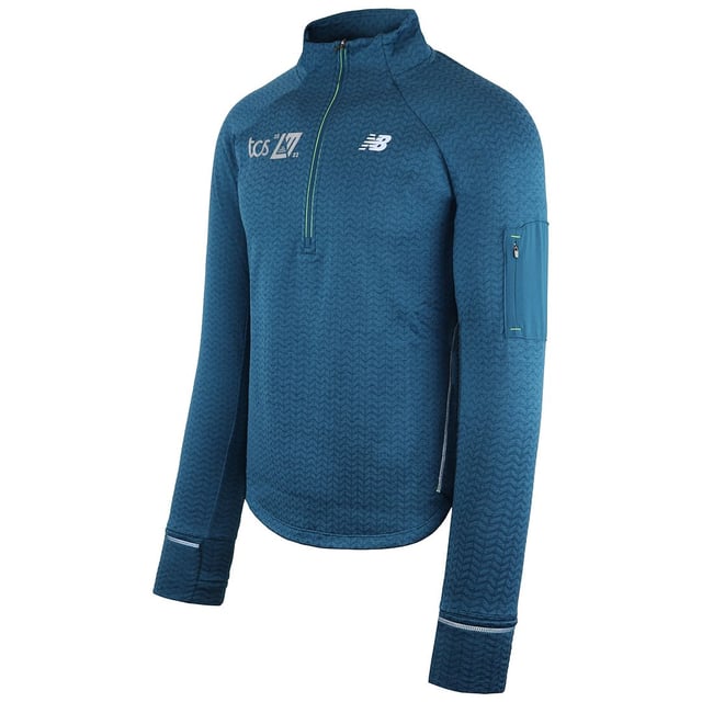 New Balance NB Heat Grid Men's Sweater â€“ a sophisticated and functional addition to your casual wardrobe. Engineered with New Balance's commitment to quality and innovative design, this sweater seamlessly combines modern style with advanced heat retention technology.

Key Features:

 Heat Grid Technology:  New Balance often integrates advanced heat retention or insulation technology into its apparel. The Heat Grid technology in this sweater helps to trap and retain body heat, keeping you warm in cooler weather.

 Moisture-Wicking Fabric:  Expect moisture-wicking properties in the fabric, designed to pull sweat away from the body. This feature helps to keep you dry and comfortable during activities.

 Modern Grid Design:  The sweater may feature a contemporary grid pattern or design, adding a stylish and dynamic element to the overall aesthetic.

 Comfortable Fabric Blend:  The sweater is likely crafted from a comfortable fabric blend, offering a soft feel against the skin while providing warmth.

 New Balance Logo Branding:  The iconic New Balance logo may be featured on the sweater, symbolizing the brand's commitment to quality and performance.