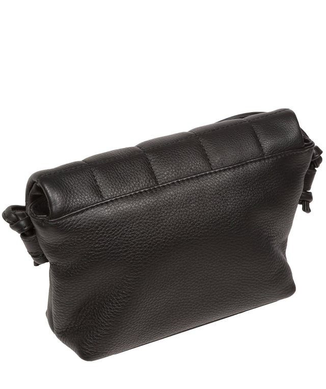 The 'Zoey' cross body bag from the Pure Luxuries London Marylebone Collection is handcrafted from high-quality, genuine Nappa leather with a natural super-soft touch. The fold-over top features an eye-catching quilted design and is secured by a magnetic press stud. The interior is lined with 100% cotton and includes two card slots, to help keep maintain an organised bag. Comes with an adjustable slim leather strap, with a drop length of 65cm. The Pure Luxuries logo is embossed in gold foil for a beautifully simple finishing touch.